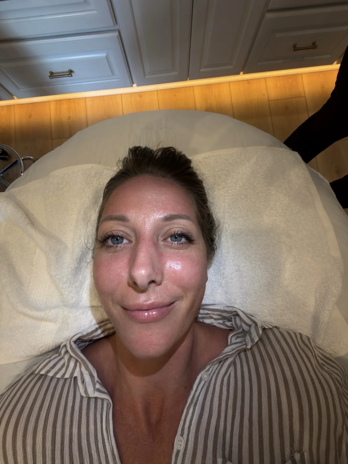 Guest smiling after her HydraFacial with visibly glowing skin